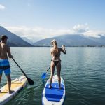 stand-up-paddling-tour-am-zeller-see---stand-up-paddling-tour-on-lake-zell-c-zell-am-see-kaprun-tourimus_original Two people on stand-up paddling boards on Lake Kaprun.